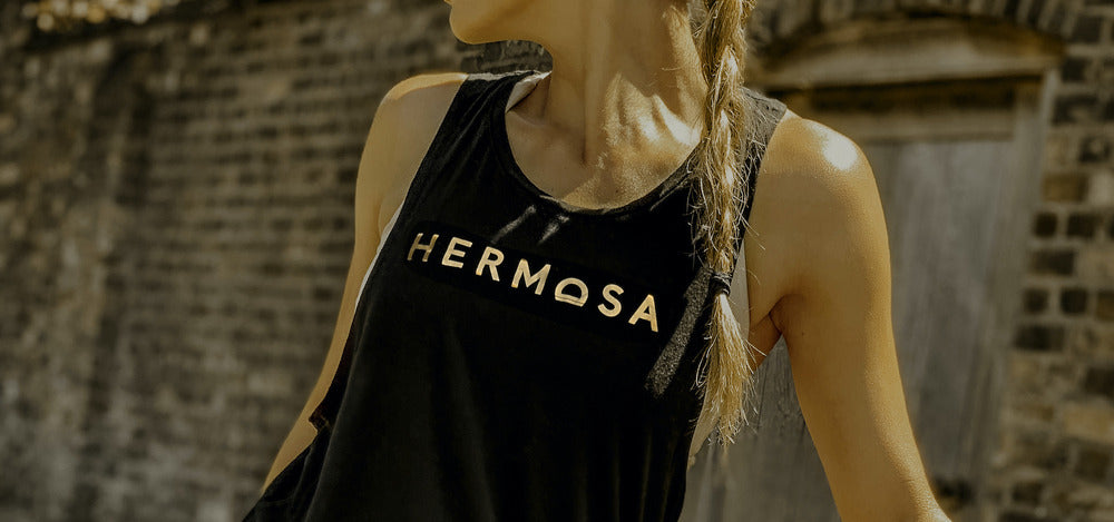 Image of a HERMOSA wearing a HERMOSA tank top